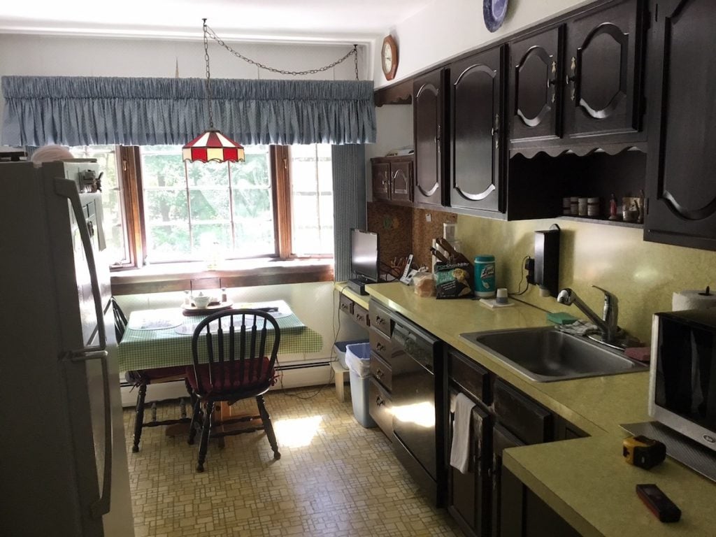 Original Kitchen with Soffit and Unused Desk at the End