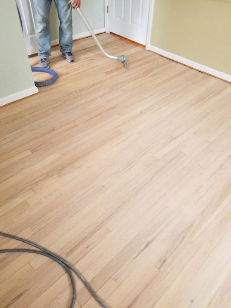 Vacuuming remaining dust before applying sealant