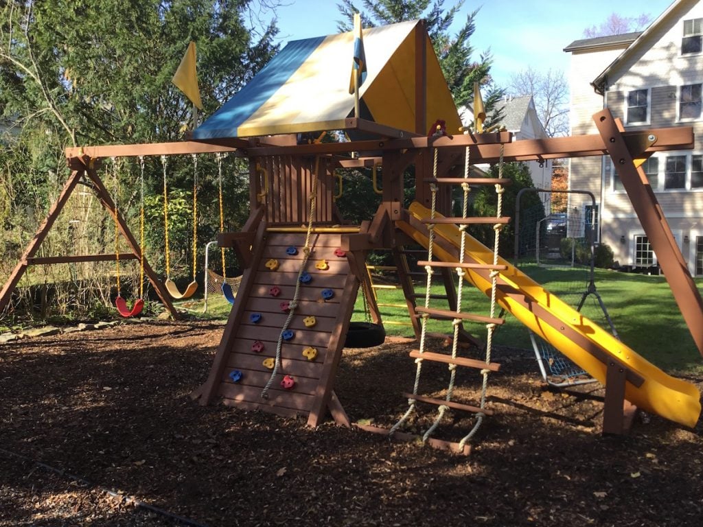 Staining a Backyard Swing Set