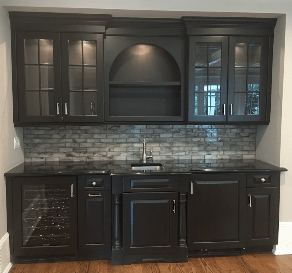 Bar Cabinetry Painted Black with Marble Backsplash