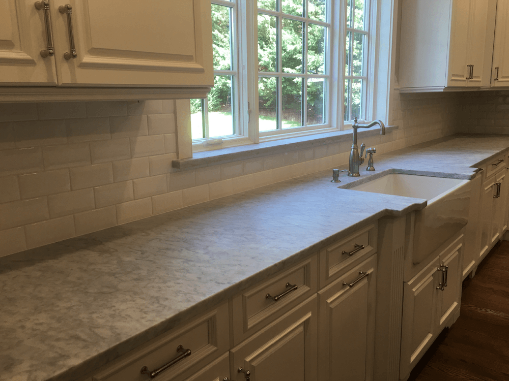 New countertops, backsplash and painted cabinetry