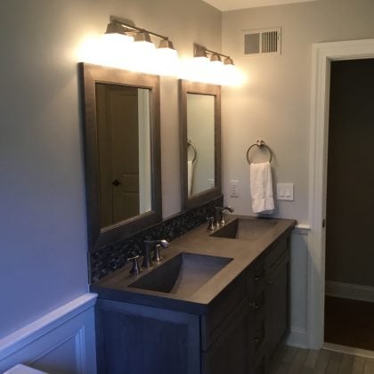 Boy's Bathroom with Concrete Countertop and Sinks