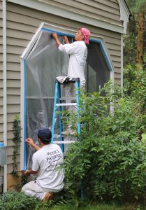 Taping up the windows prior to sanding