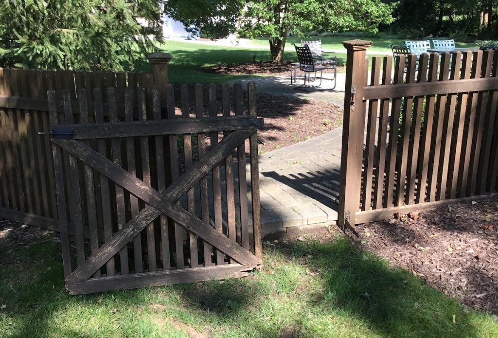 Gate Fallen Off the Rusted Hinges