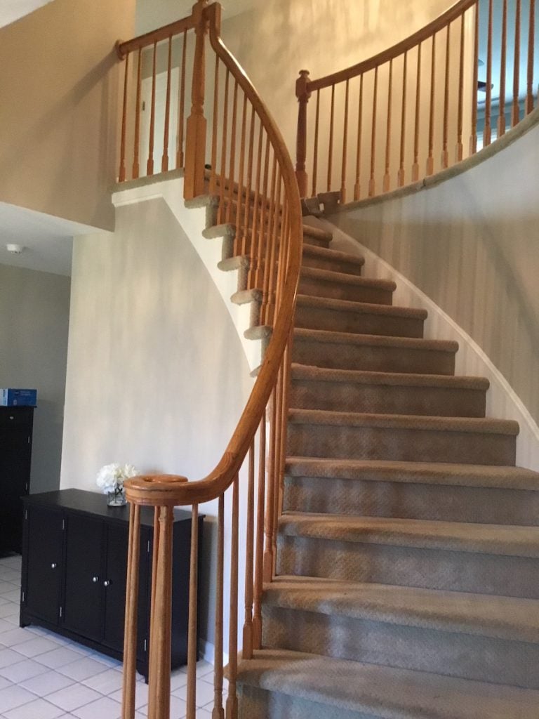 Dated Carpeted Stairs and Oak Railings