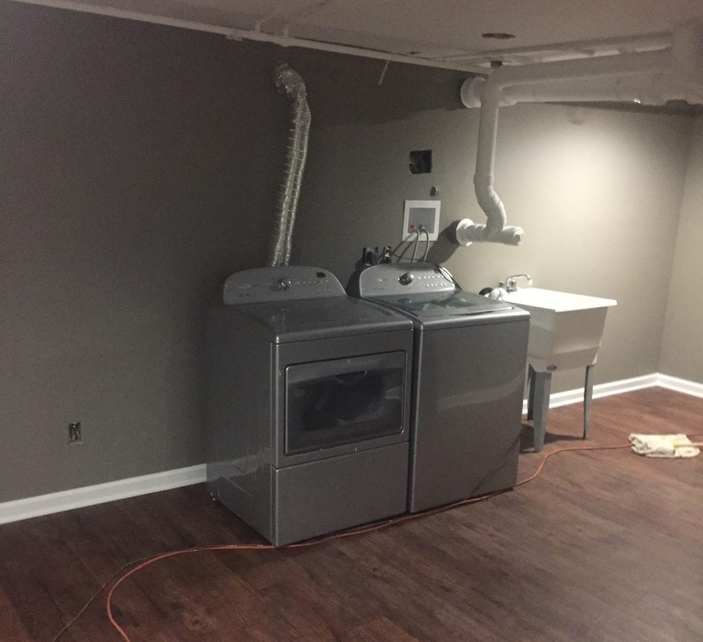 Finished Laundry Area with Luxury Vinyl Tile Floor