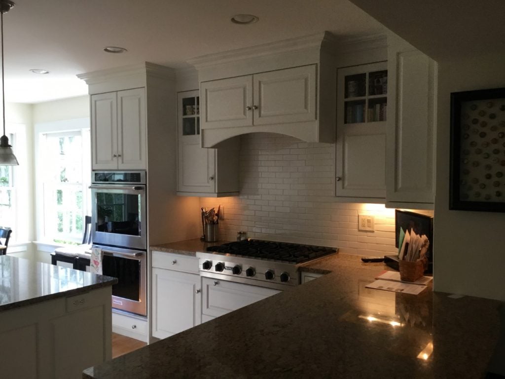 Cabinets were lightened, countertops were darkened