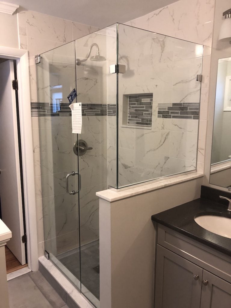 Marble Shower & Grey Vanity with Black Top