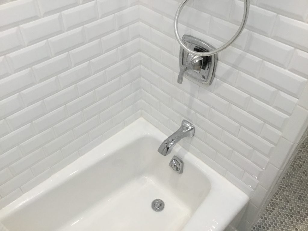 White Beveled Subway Tile over Tub