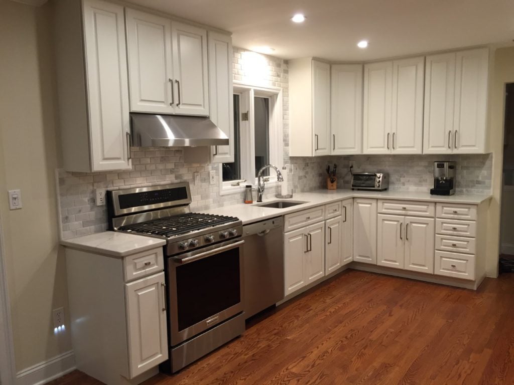 Painted White Cabinetry, New Backsplash and Countertops