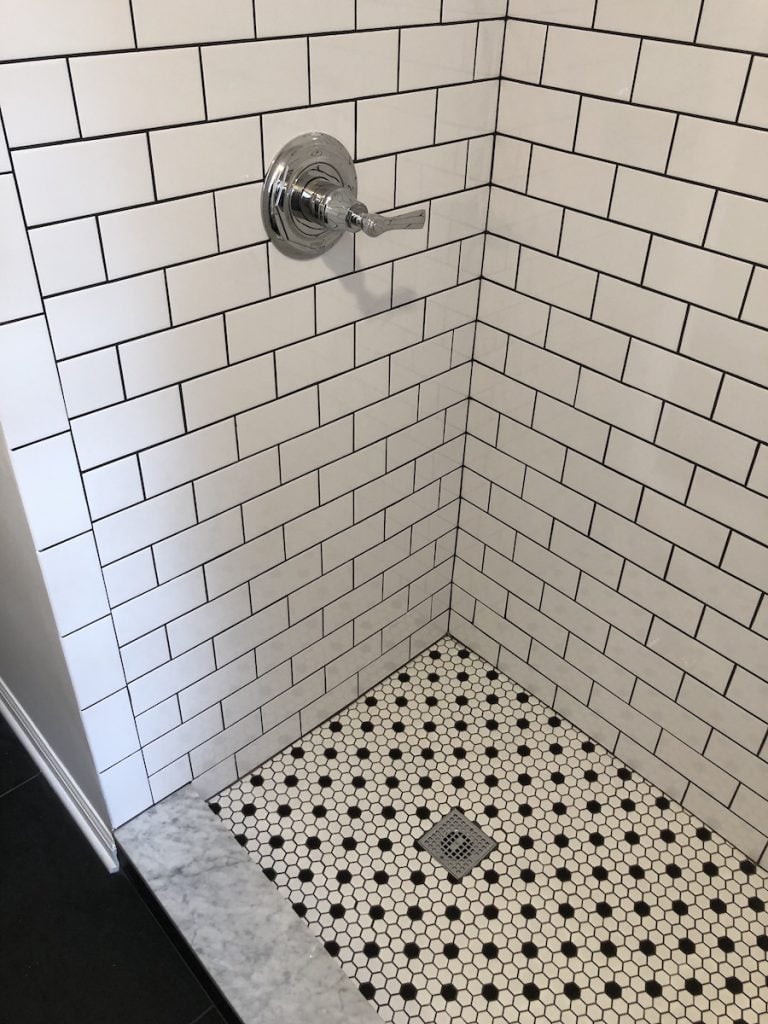 Black Grout and Mosaic Black and White Shower Floor Tile