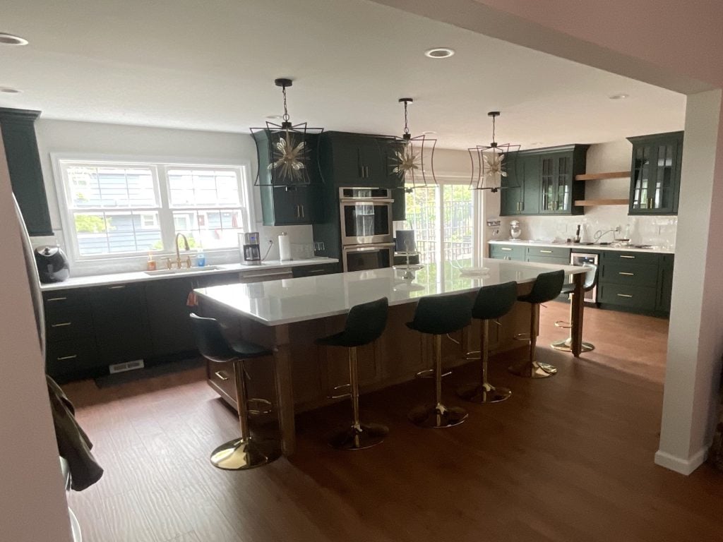 View of kitchen with bar seating and bar cabinetry